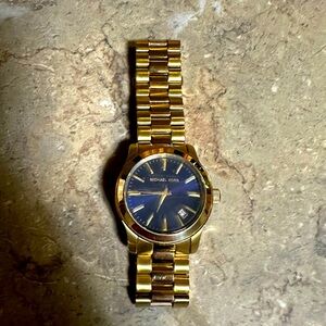 Michael Kors gold tone, blue face watch